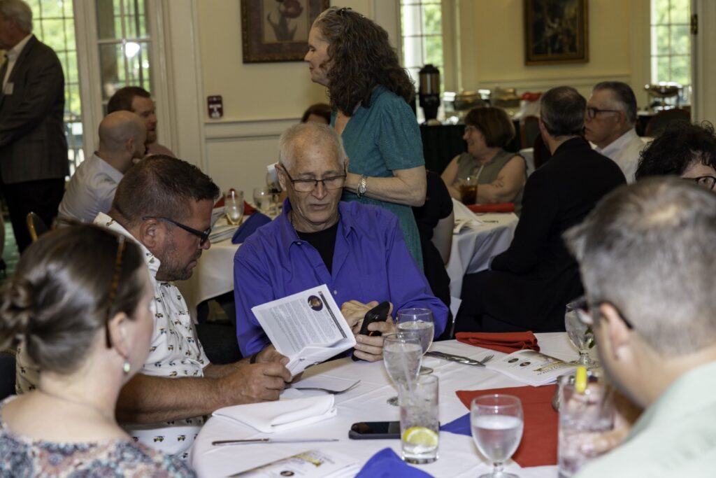 Distinguished Citizen Award recipient speaking at a podium during a Garden State Council recognition event.