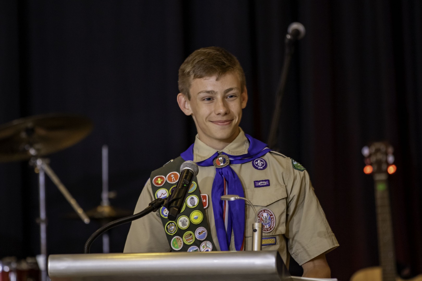 Eagle Scout smiling while standing at a podium during the 2026 Prepared for Life Celebration.